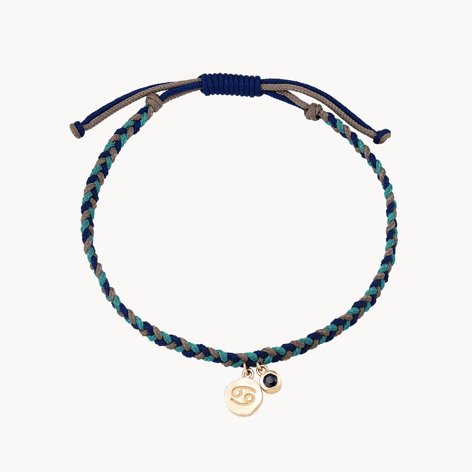 Faceted cut bracelet-cancer zodiac water element bracelet - 10k yellow gold, blue sapphire, cord